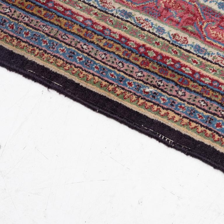 A oriental carpet, signed, c. 295 x 295 cm.