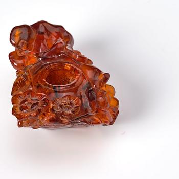 An amber brush washer and three miniature figurines, China, late Qing/early 20th Century.