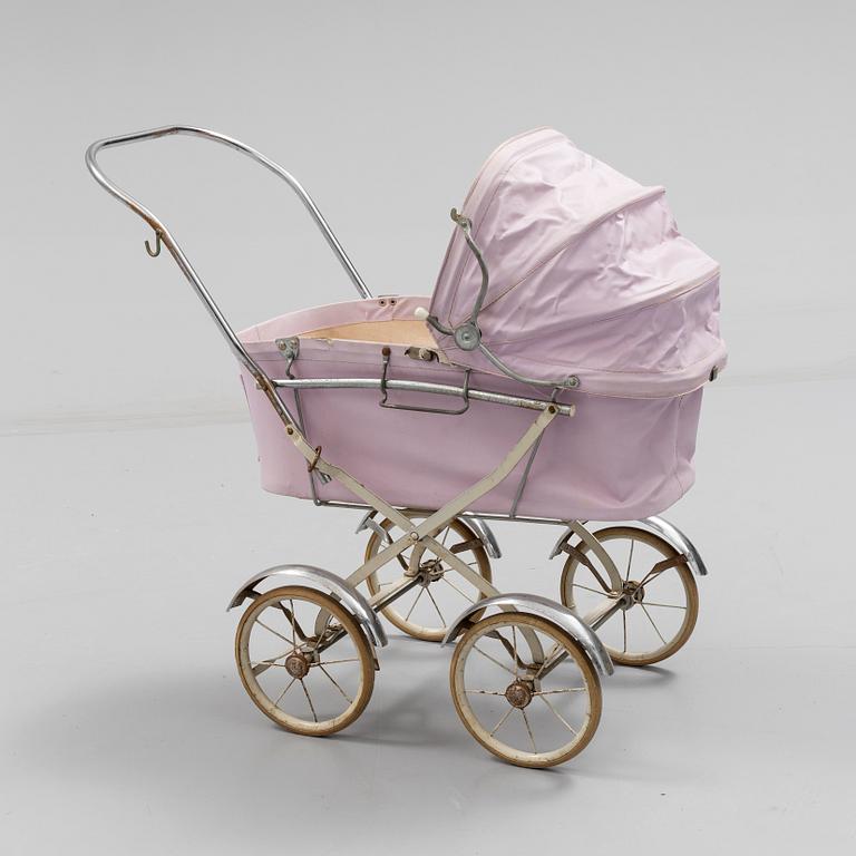 A TOY BABY CARRIAGE, 1960s.