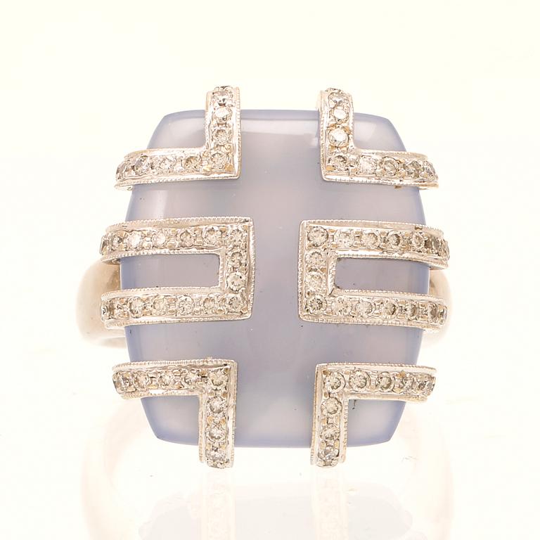 An 18K white gold ring with brilliant cut diamonds and possibly chalcedony.