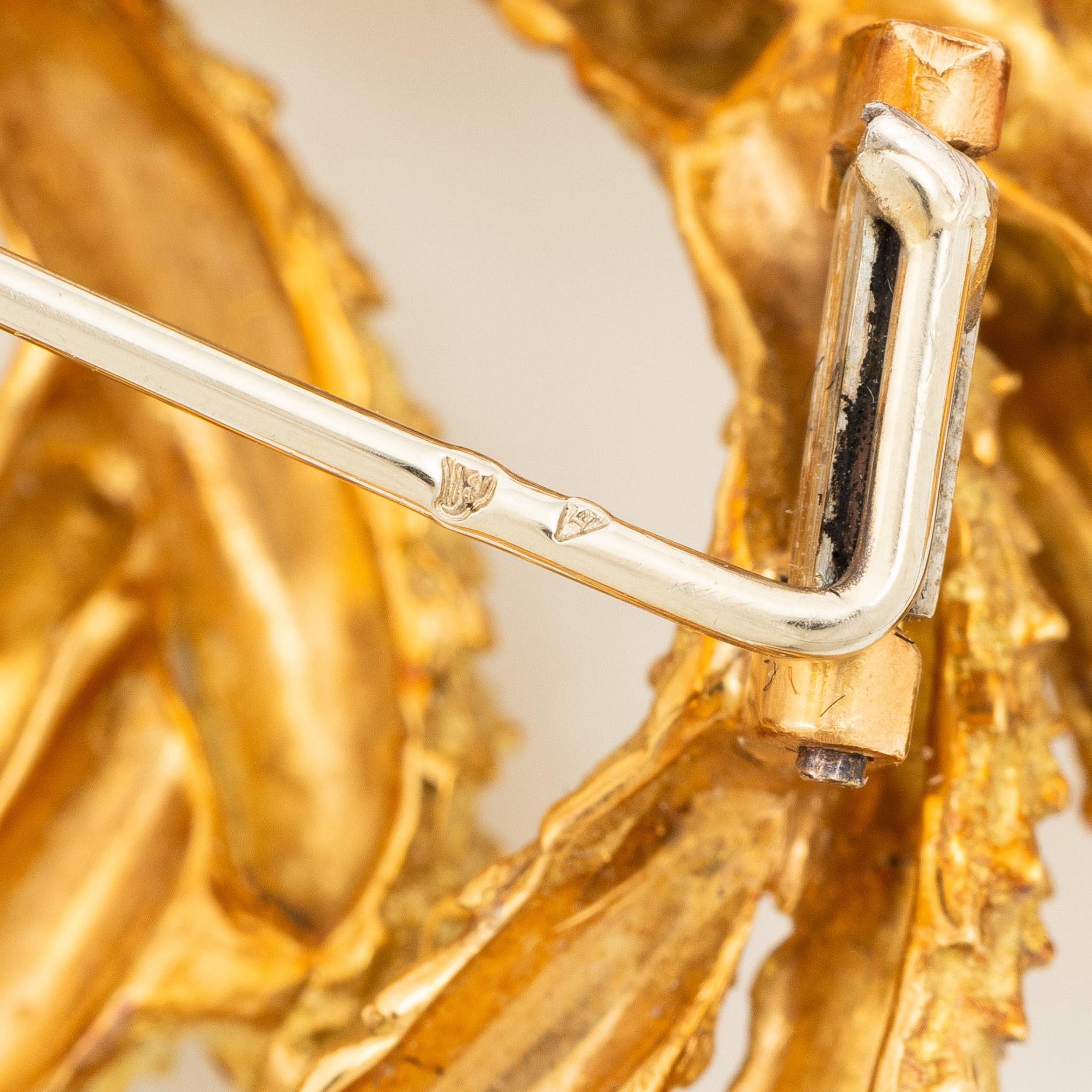 Brosch Hermès 18K guld i form av krans.