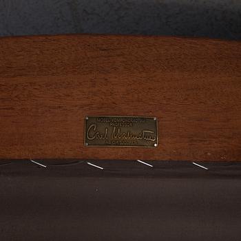 An "Vår Fru" armchair by Carl Malmsten.