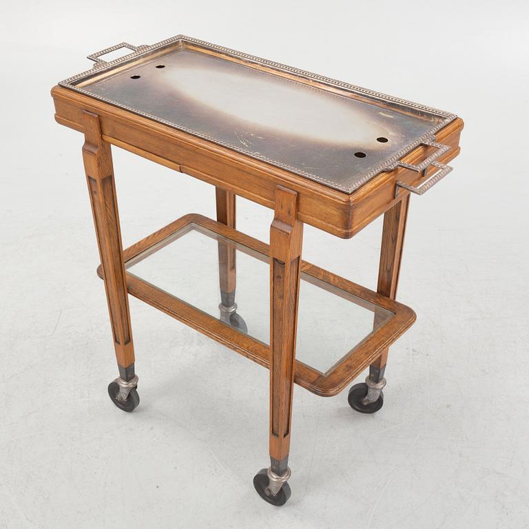A restaurant serving trolley with silver plate dishes, first half of the/mid 20th century.