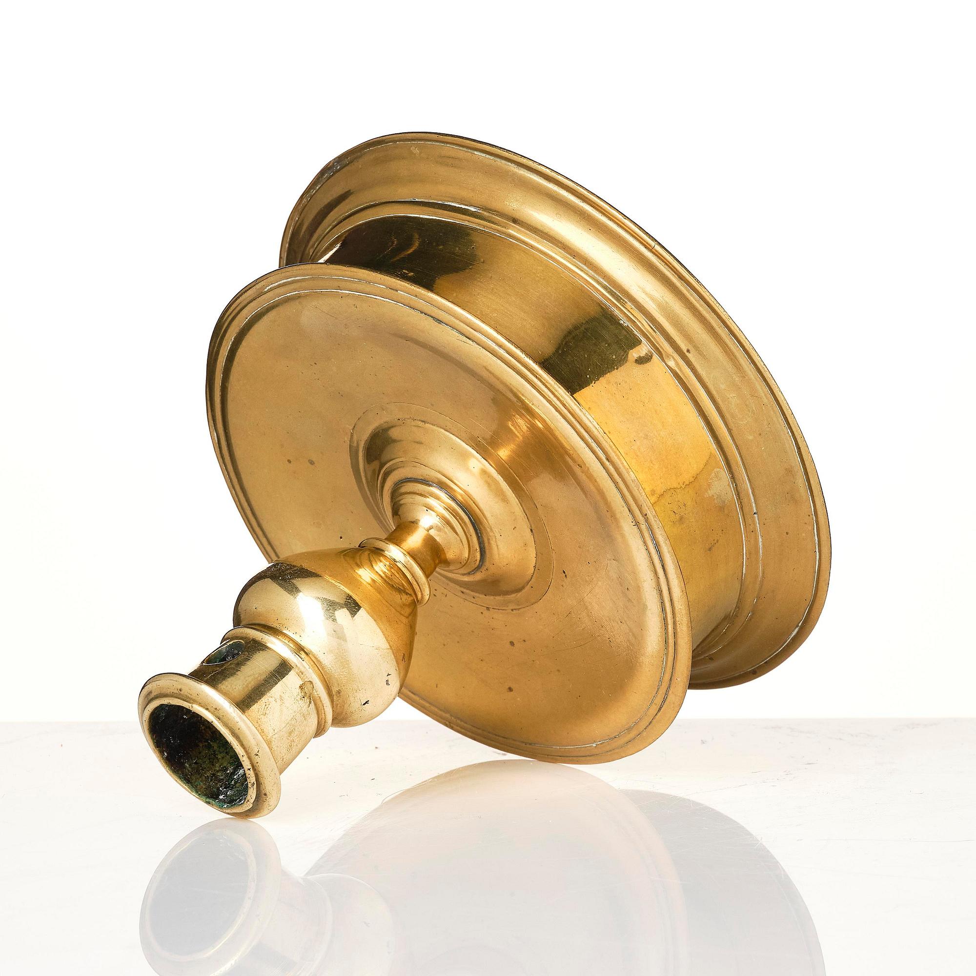 A Northern European baroque brass candlesticsk, late 17th century.