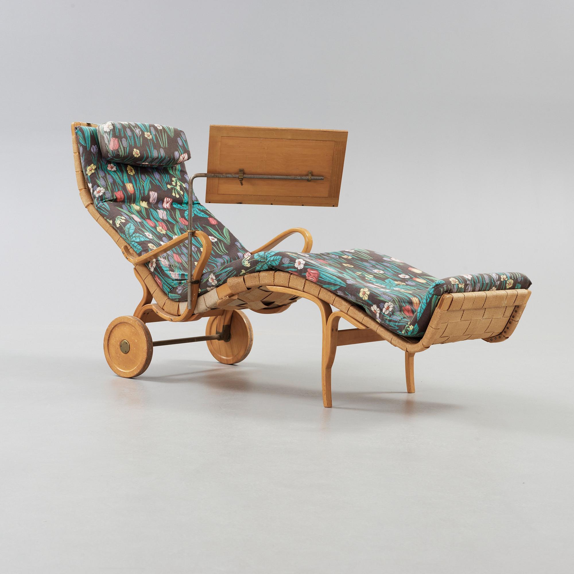 A Bruno Mathsson Swedish Modern chair with attached reading table, Karl Mathsson, Värnamo 1944.