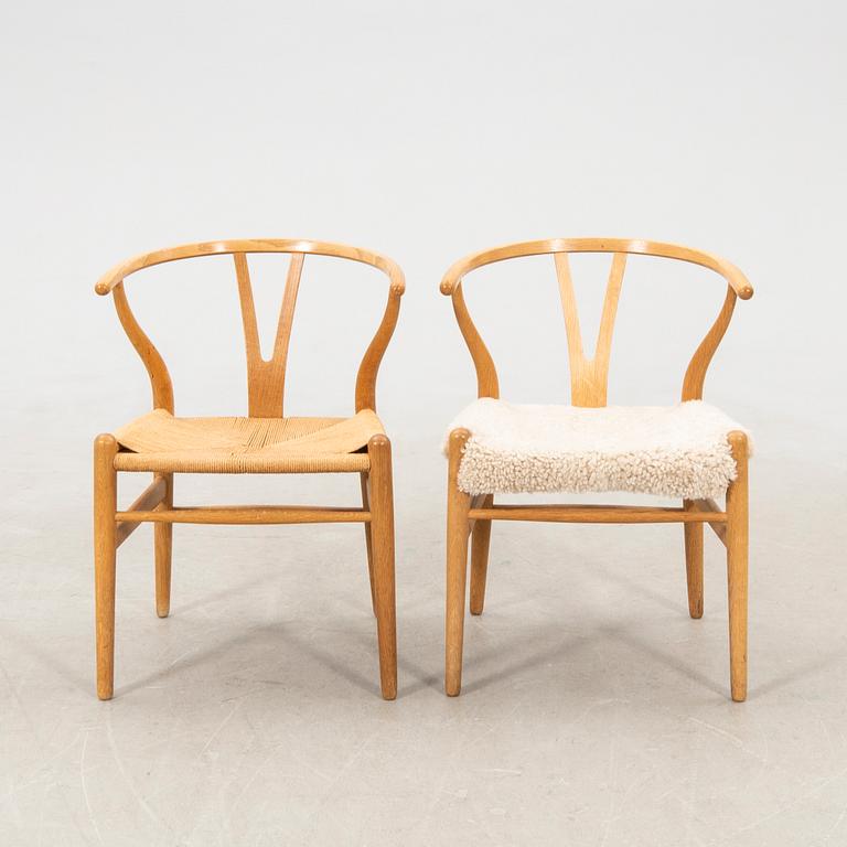 Hans J. Wegner, chairs, a pair of "The Wishbone Chair", model CH-24, Carl Hansen & Søn, Denmark.