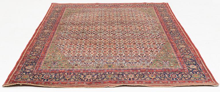 A carpet, semi.-antique, possibly Tabriz, ca 291 x 203 cm.
