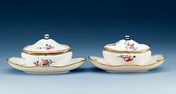 1422. Two Sèvres sauce tureens on stands, 18th Century, one soft paste, dated HH for 1785.