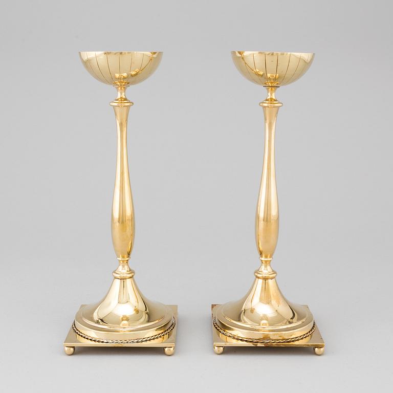 A pair of mid 20th century brass candlesticks by Gunnar Ander for Ystad Metall.