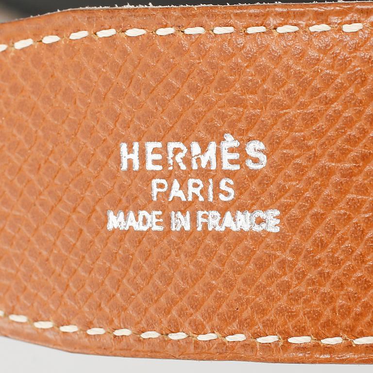 A leather belt from Hermès.