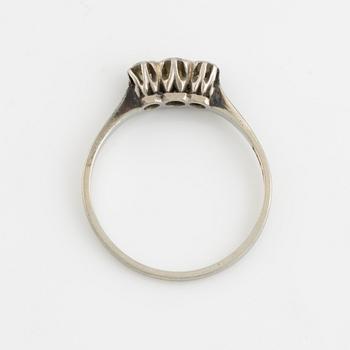 White gold and three brilliant cut diamond ring.