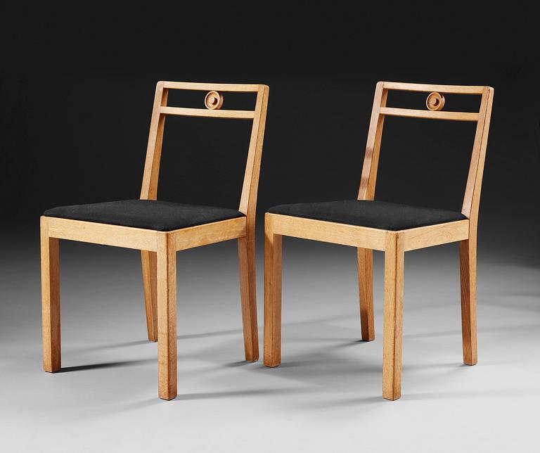 A pair of Axel-Einar Hjorth white chalked oak chairs 'Dagmar' by NK, Sweden 1935.