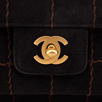 A CHOCO BAR SUEDE FLAP BAG BY CHANEL.