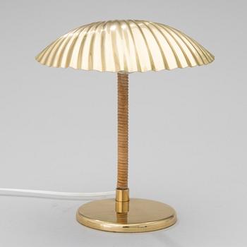 PAAVO TYNELL, A DESK LAMP. A shell.  Manufactured by Taito Oy. Designed in 1938/39.