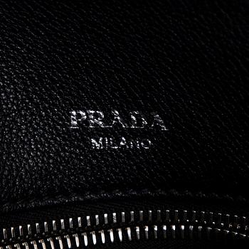 Prada, a leather bag.