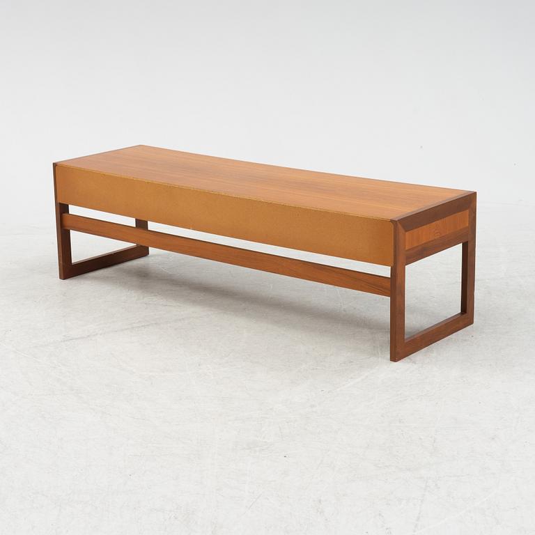 A teak veneered TV bench, 1960's.