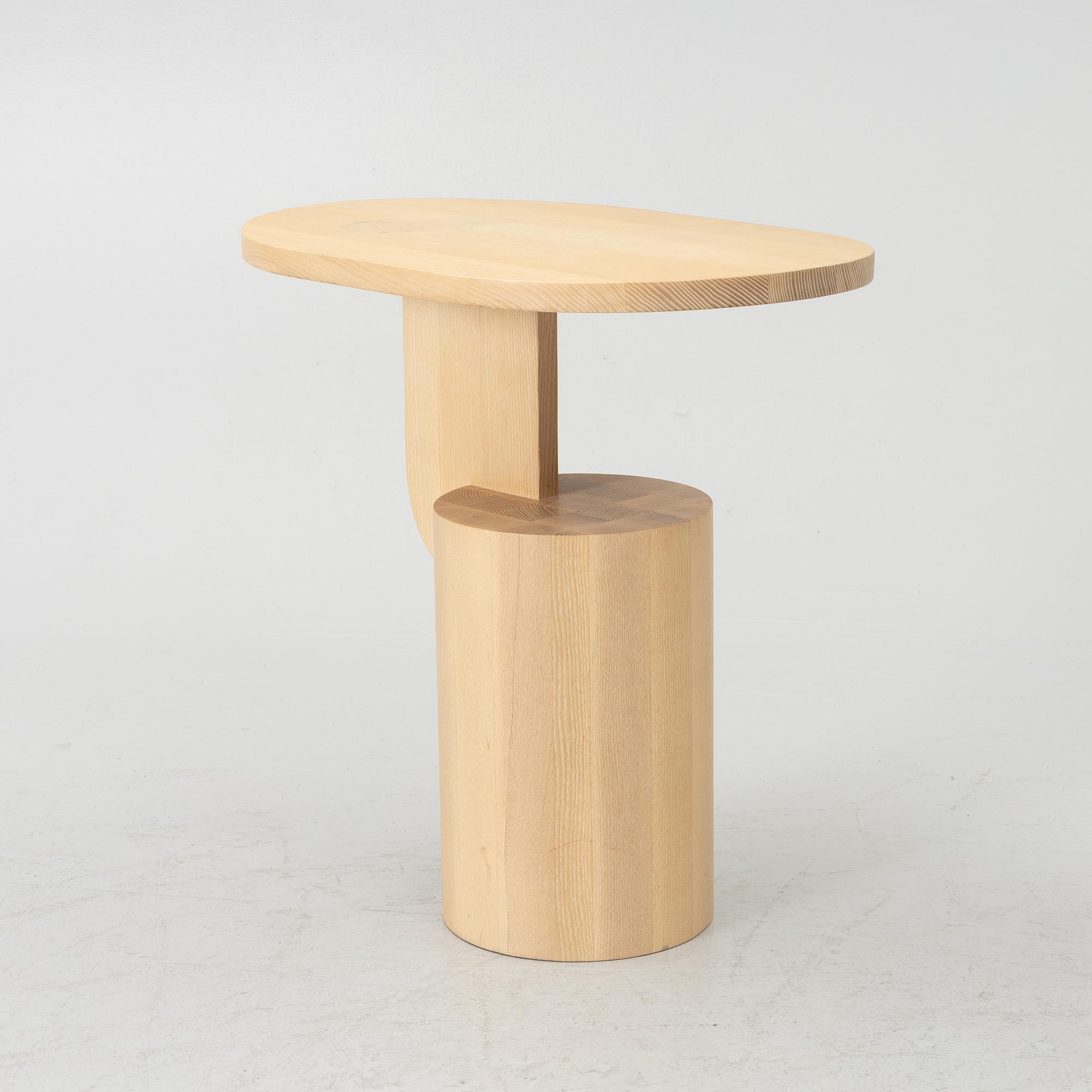 An 'Insert' side table, Firm Living.