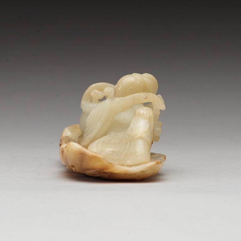 A Chinese nephrite figure of a lady with a flower basket, qing dynasty (1644-1912).