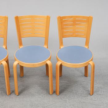 Table with four chairs, late 20th Century by Magnus Olesen.