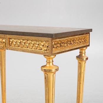 A console table with stone top.