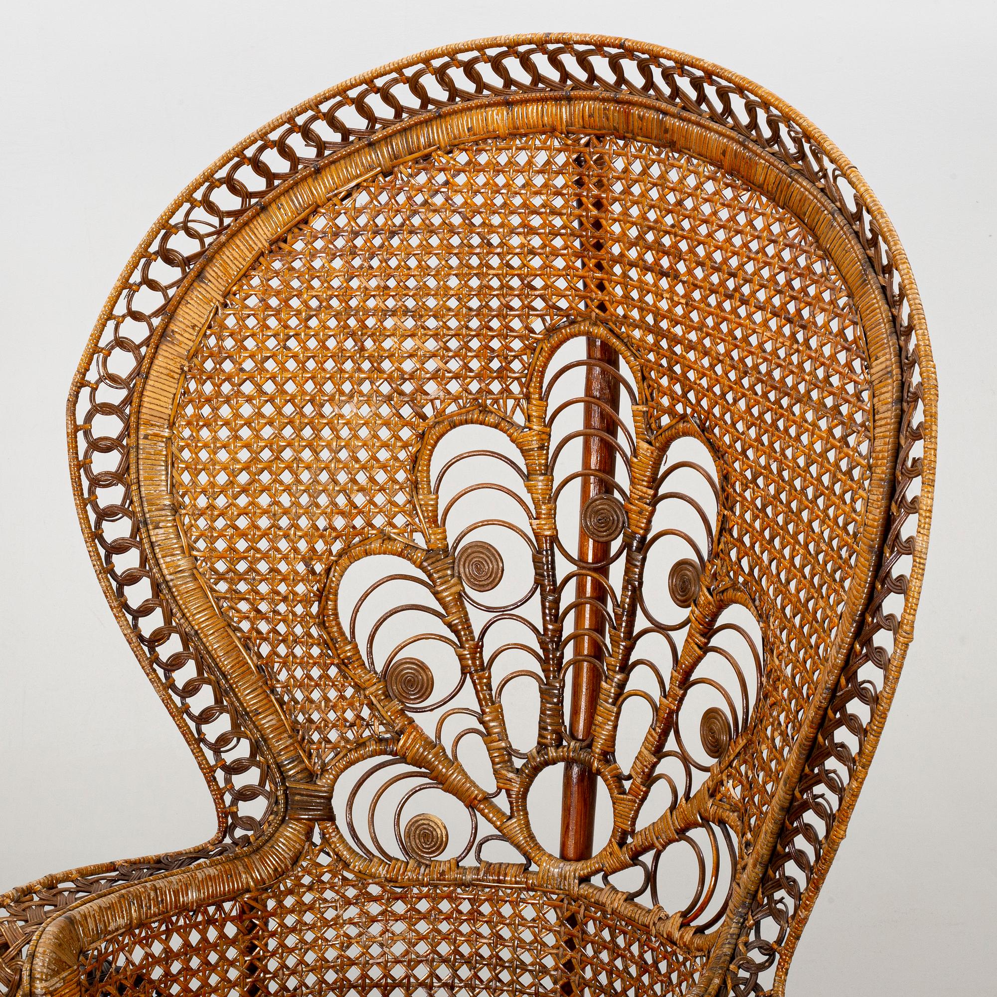 A RATTAN ARMCHAIR.