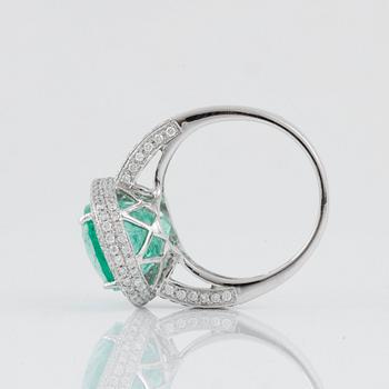 A green beryl, circa 6.00 cts, and diamond, circa 1.30 cts, ring.