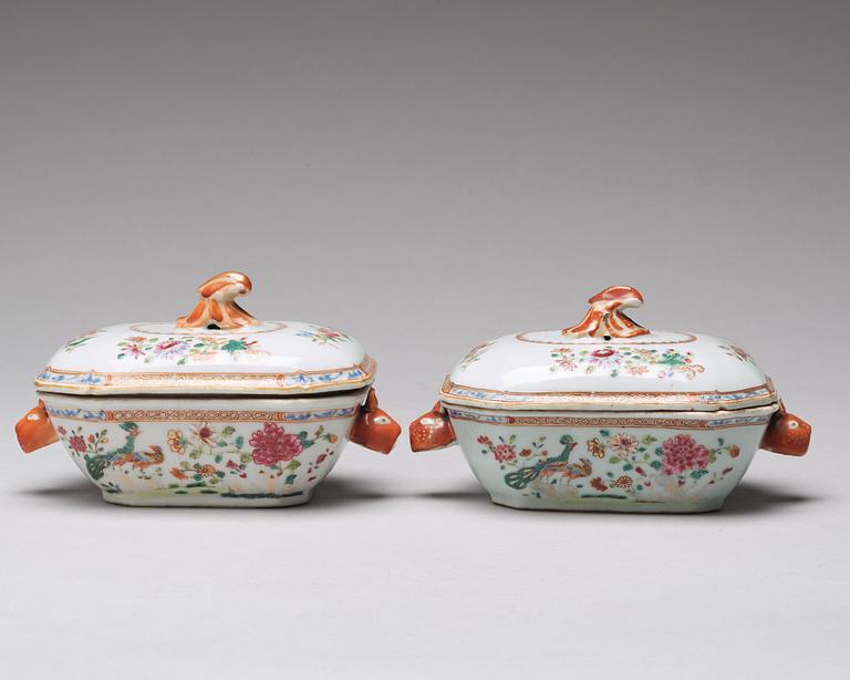 A pair of famille rose 'double peacock' butter tureens with cover and stand, Qing dynasty, Qianlong (1736-95).