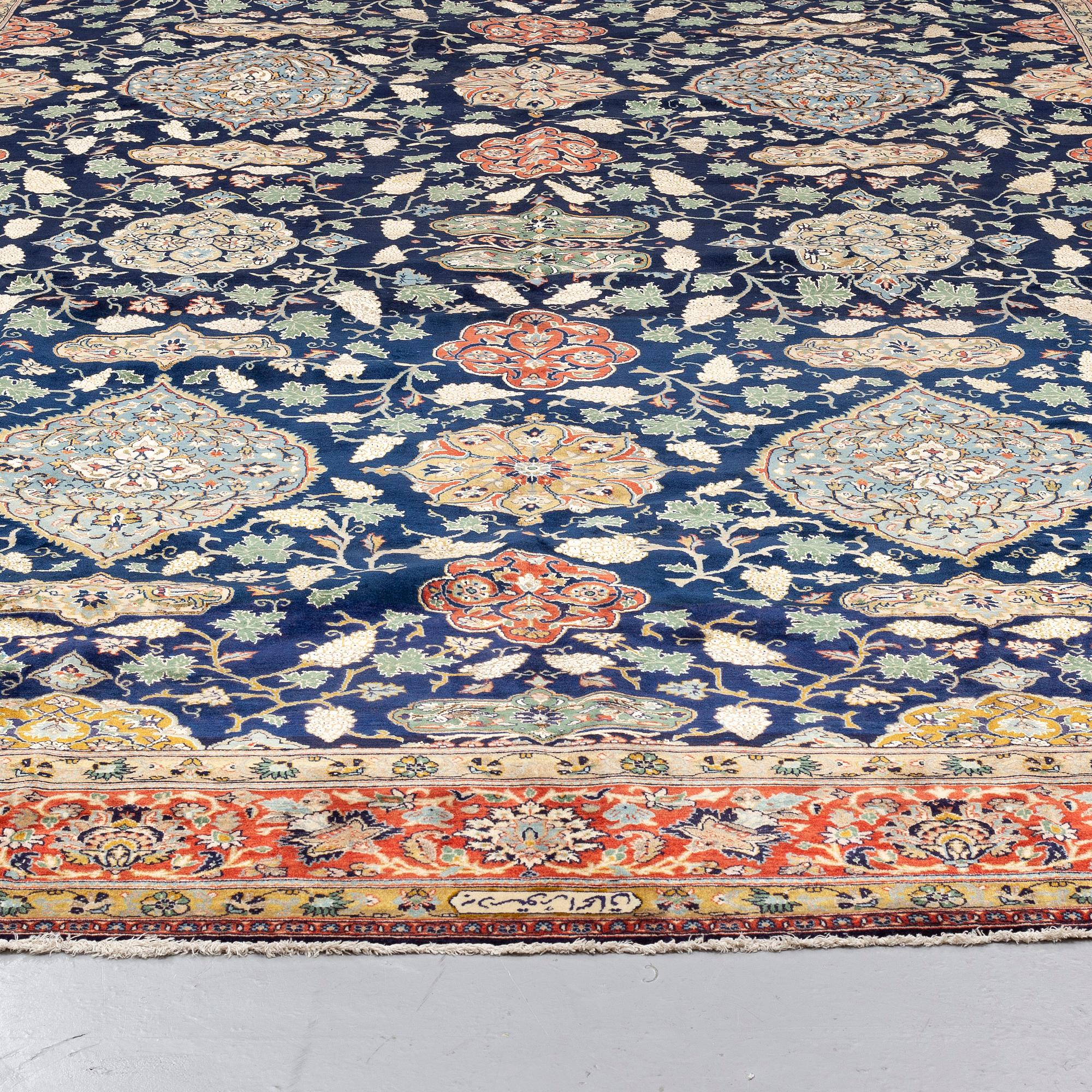 A CARPET so called Royal Kashan, part silk, signed, ca 483 x 311 cm.