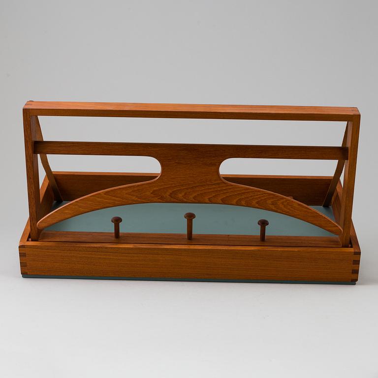 A clothes hanger by Adam Hoff & Poul Östergaard, Virum Möbelsnickeri, Denmark, mid 20th century.
