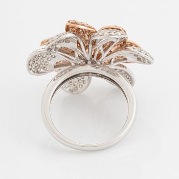 Brilliant cut diamond flower ring.