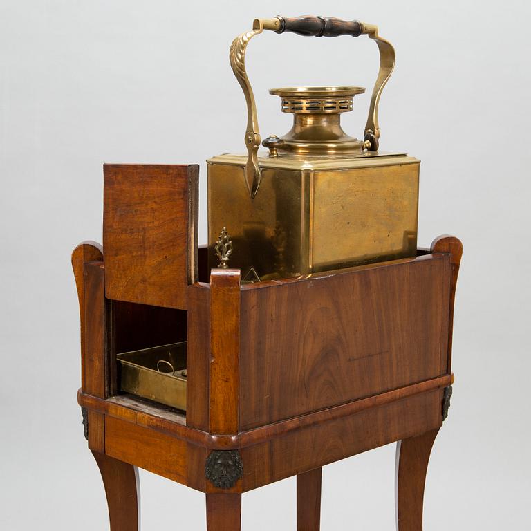 A brass samovar in a stand with a Kuznetsov porcelain teapot and bowl, latter half of the 19th century and early 1900s.