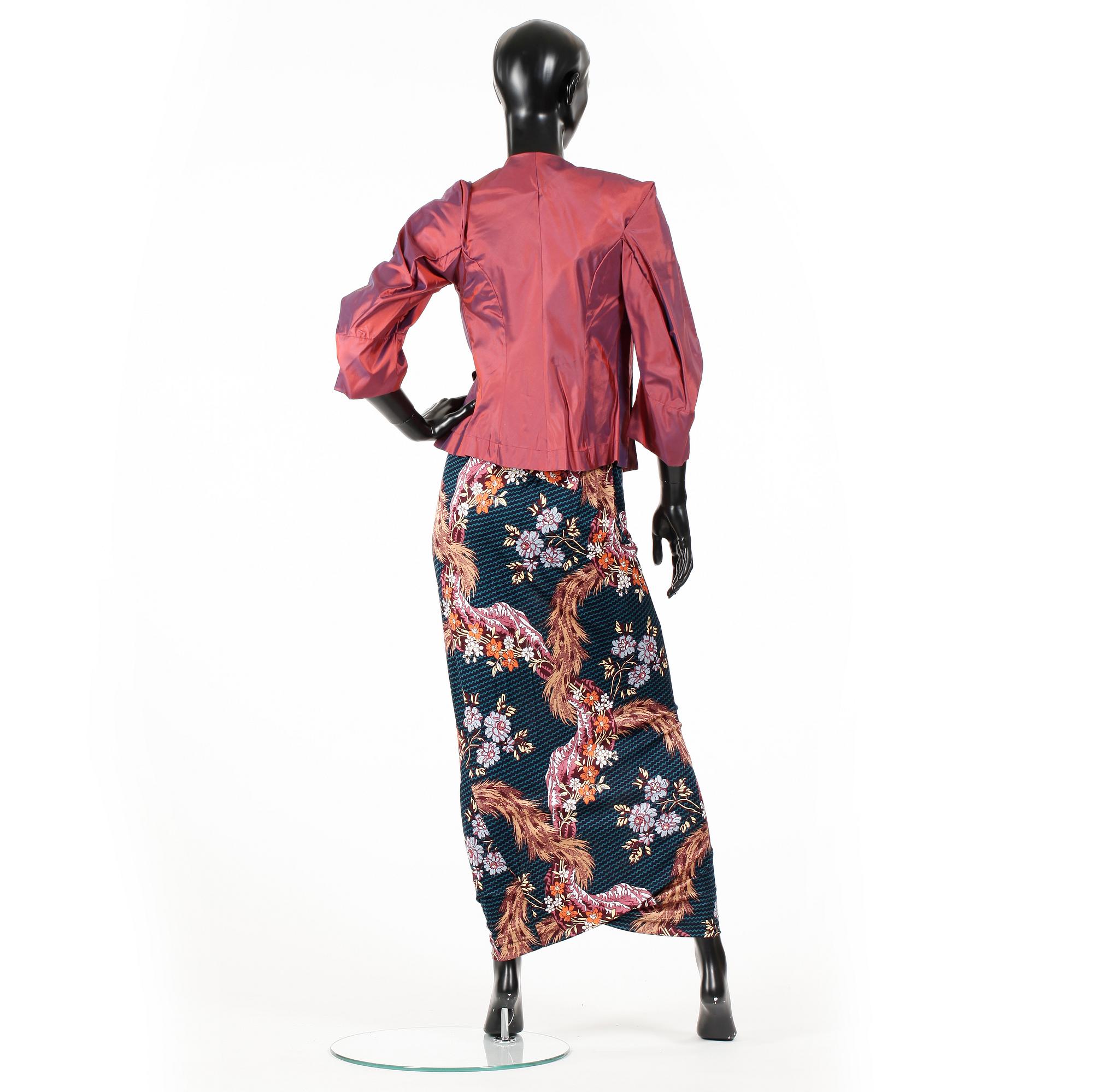 VIVIENNE WESTWOOD, a three-piece ensemble consisting of jacket, top and skirt.