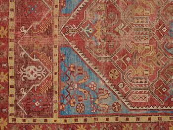 A RUG, an antique Anatolian, the Ottoman Empire, ca 154,5-158 x 99,5-102,5 cm (as well as 1 cm flat weave at one end).