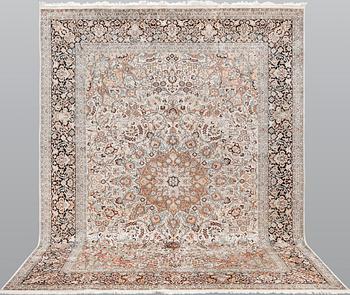 A silk Kashmir carpet, ca 330 x 246 cm.