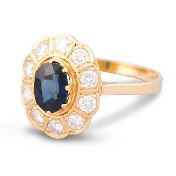 127. A RING, facetted sapphire, brilliant cut diamonds, 18K gold. Meidän sepät, Espoo Finland 1991.