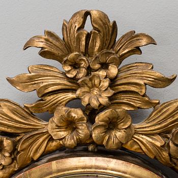 A late Gustavian gilt wood wall clock by Ephraim Hedström (active 1808-1818), Stockholm.