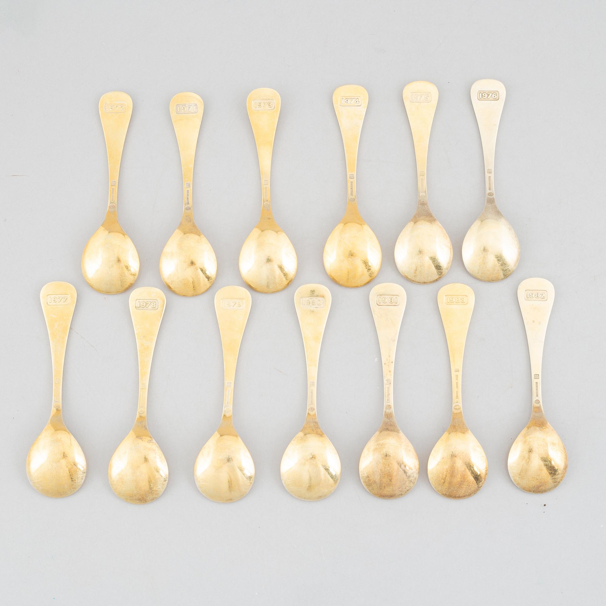Georg Jensen, Christmas spoons/annual spoons, 13 pcs, gilded silver, Denmark 1971-1983.