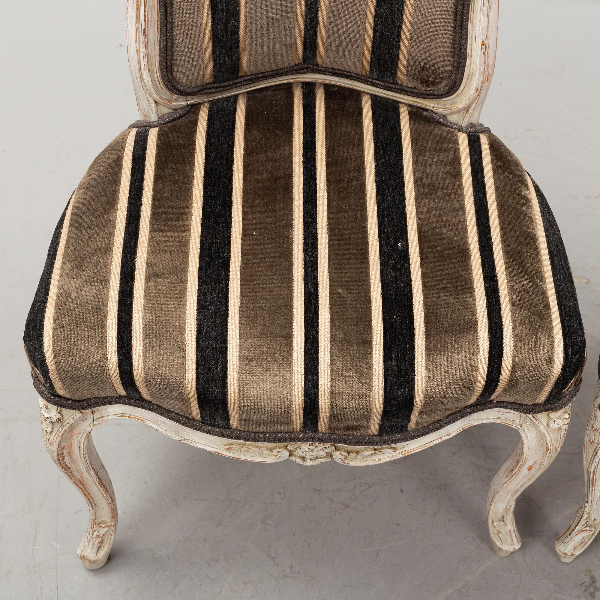 A matched set of six painted french rococo chairs, mid 18th Century.