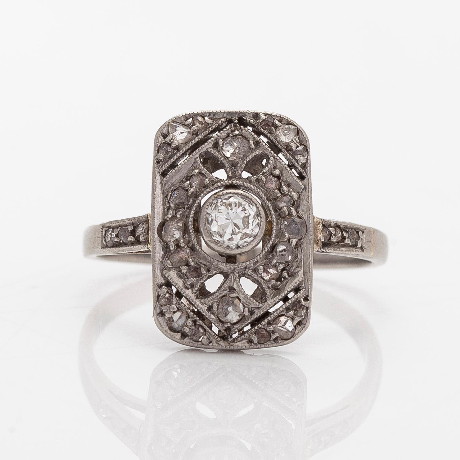 A platinum art deco ring with old-cut and rose-cut diamonds, Moscow, first half of the 20th century.