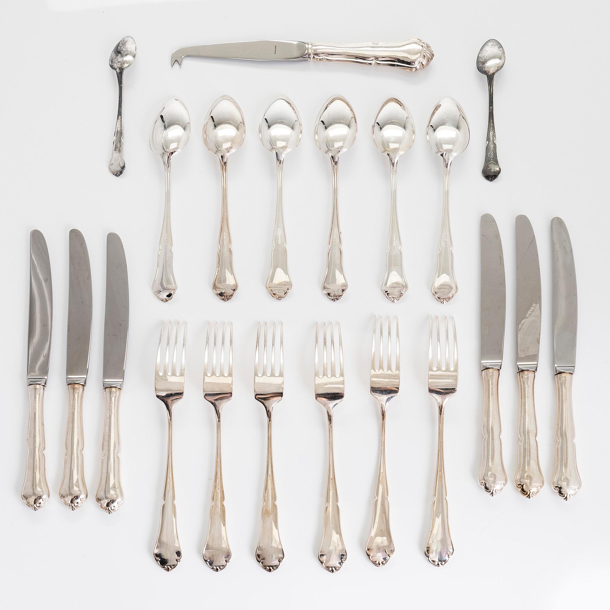 A 21-piece set of 'Chippendale' silver cutlery, and 11 silver coaster, Turku and Hämeenlinna, 1983-90 and 1964.