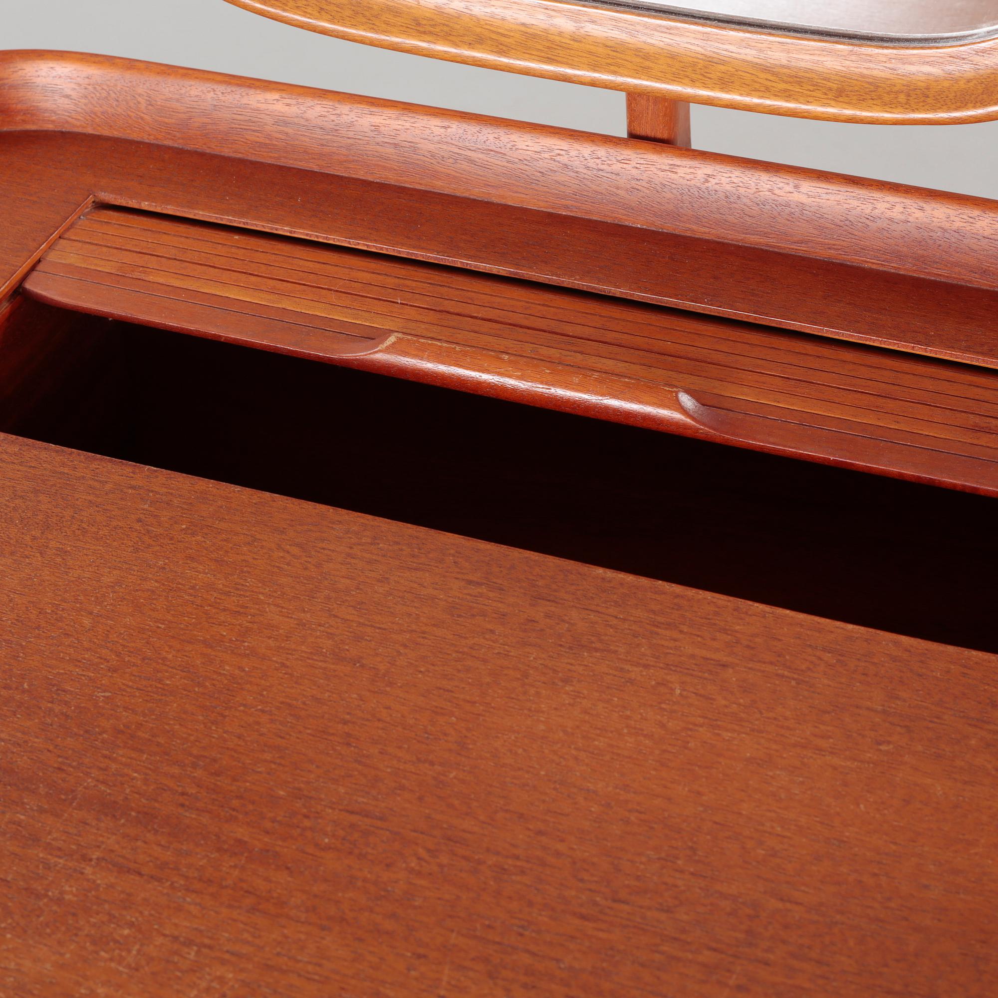 a table with mirror "Birgitta" veneered with teak designed by Carl Malmsten for Bodafors Möbelfabrik,