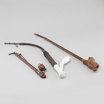 Three mainly 19th century pipes, one dated 1711.