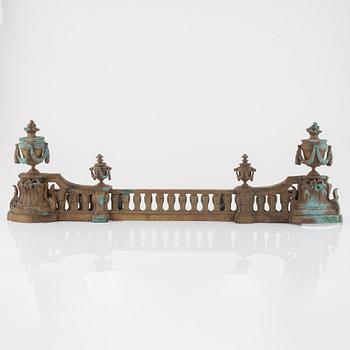 A Louis XVI style bronze grate, 19th Century.