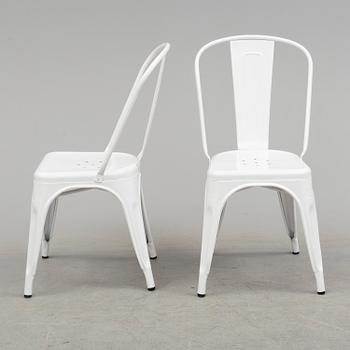 A set of four Tolix chairs.