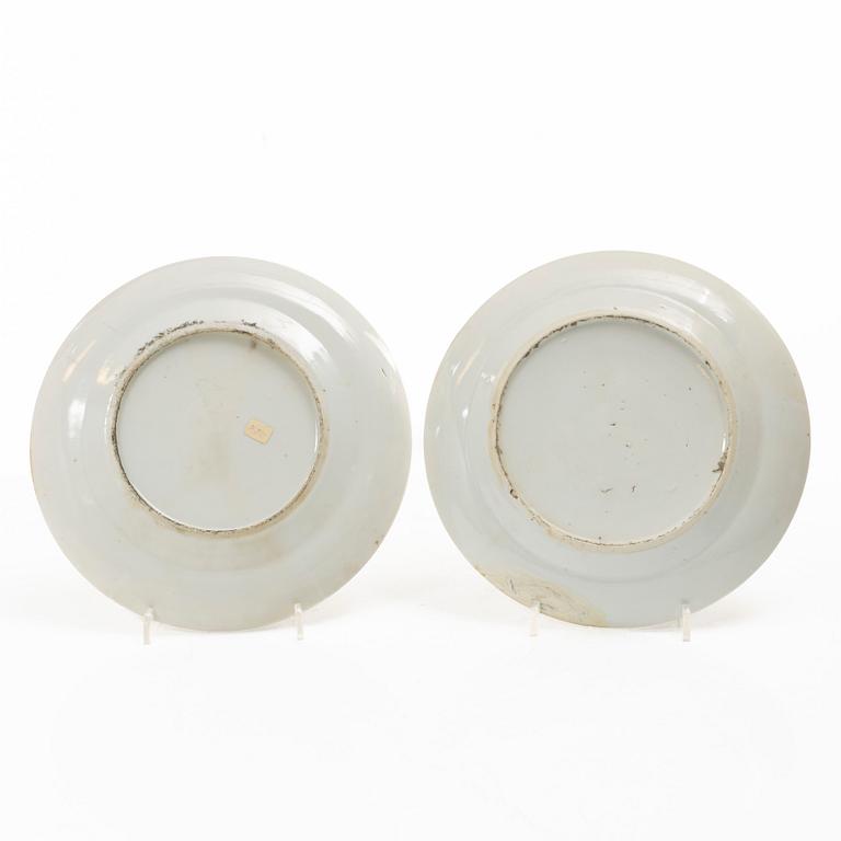 A matched set of 14 famille rose 'Canton' dinner plates, Qing dynasty, 19th century.