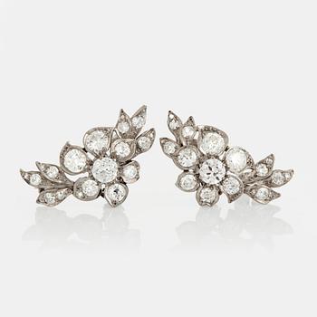 924. A pair of earrings set with old-cut diamonds.