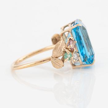 Ring, cocktail ring with large blue topaz, tourmalines, emeralds, and brilliant-cut diamonds.