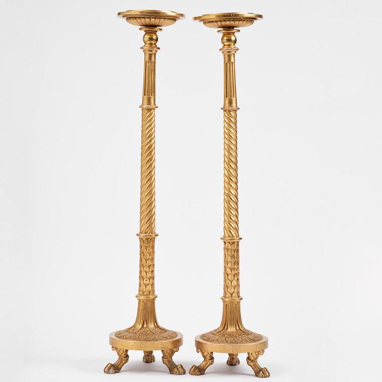 A pair of late Gustavian giltwood torchères by J. Frisk (master in Stockholm 1805-24).