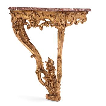 40. A Central European Louis XV carved and giltwood console table, mid 18th century.