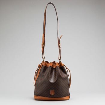 CÉLINE, a Macadam bucket bag.